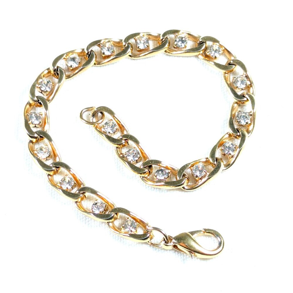 Gold toned curb link chain bracelet with clear rhinestones
